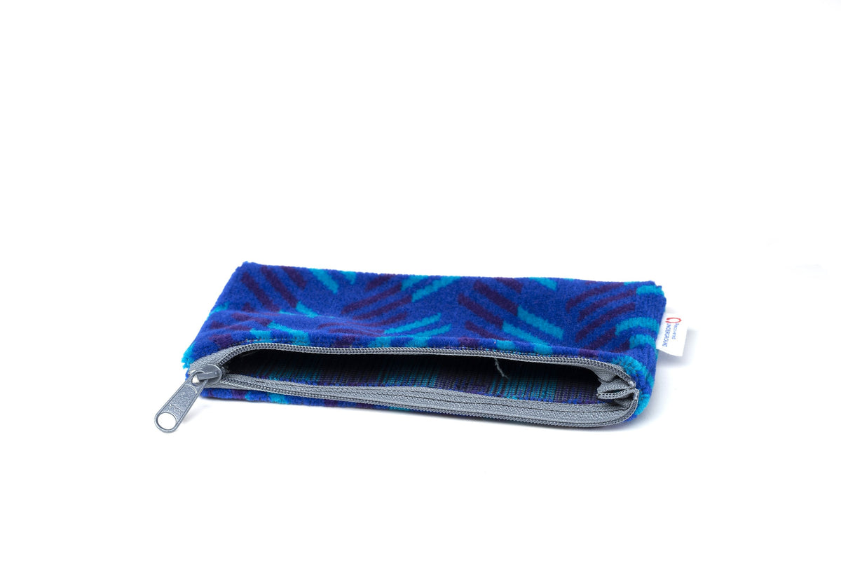 British Rail Network SouthEast Blue Blaze Moquette Pencil Case in bright blue moquette with turquoise and dark purple diagonal stripes.