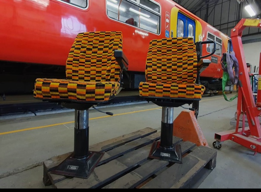 Pair of restored Chapman railway driver's seats in Misha Black moquette