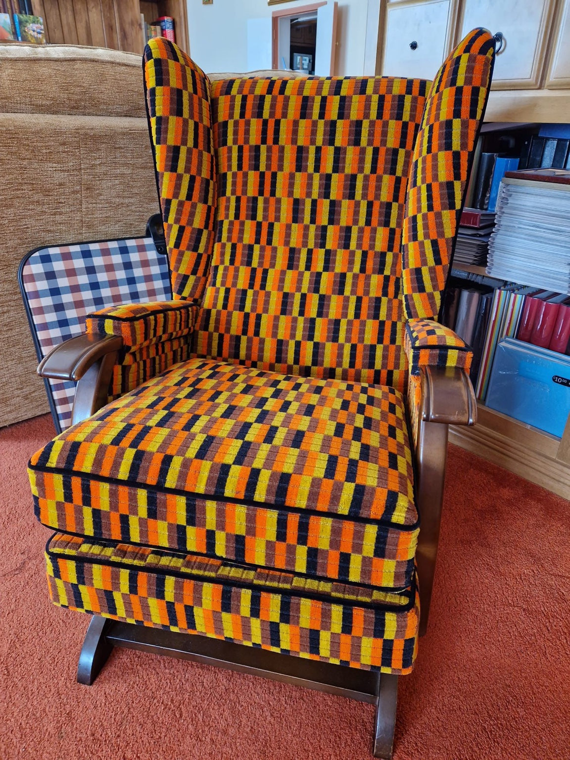 Traditional high back chair upholstered in Misha Black moquette