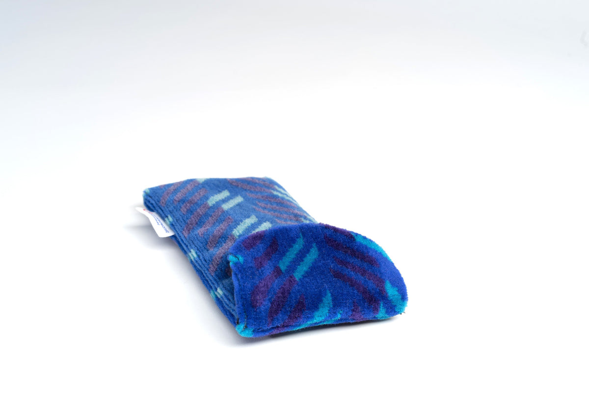 British Rail Network SouthEast Blue Blaze Moquette Phone & Glasses Case in bright blue moquette with turquoise and dark purple diagonal stripes.