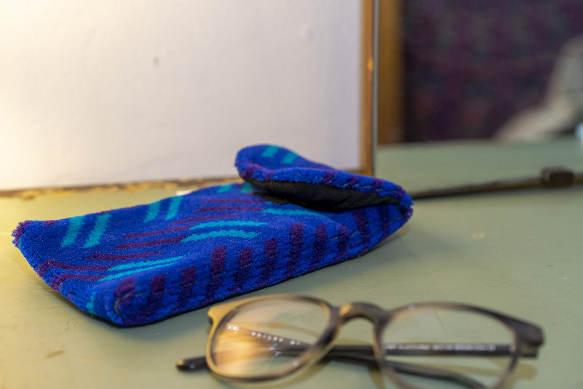 British Rail Network SouthEast Blue Blaze Moquette Phone & Glasses Case in bright blue moquette with turquoise and dark purple diagonal stripes.