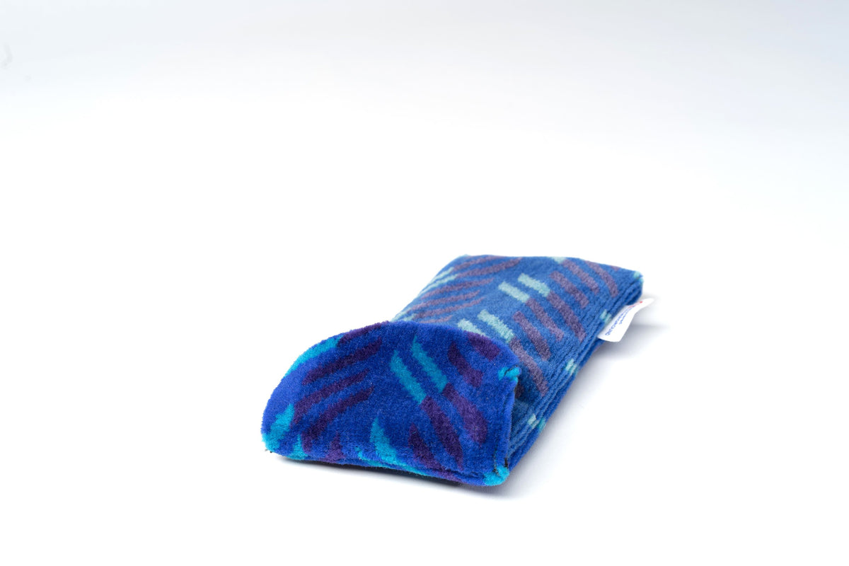 British Rail Network SouthEast Blue Blaze Moquette Phone & Glasses Case in bright blue moquette with turquoise and dark purple diagonal stripes.