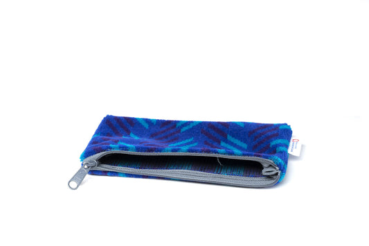 British Rail Network SouthEast Blue Blaze Moquette Pencil Case in bright blue moquette with turquoise and dark purple diagonal stripes.