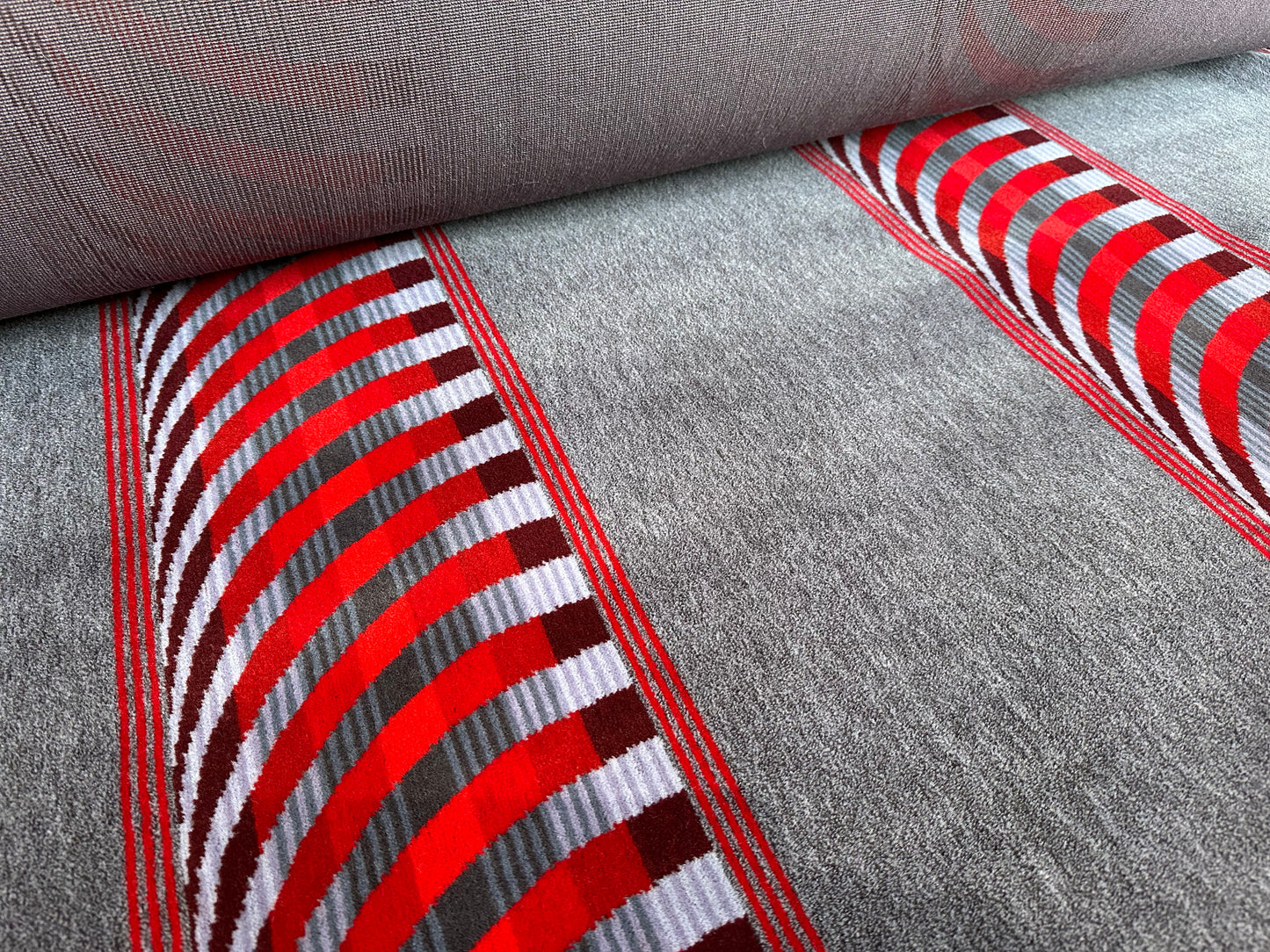 Red cheveron on grey  Moquette Fabric Sold by the Metre