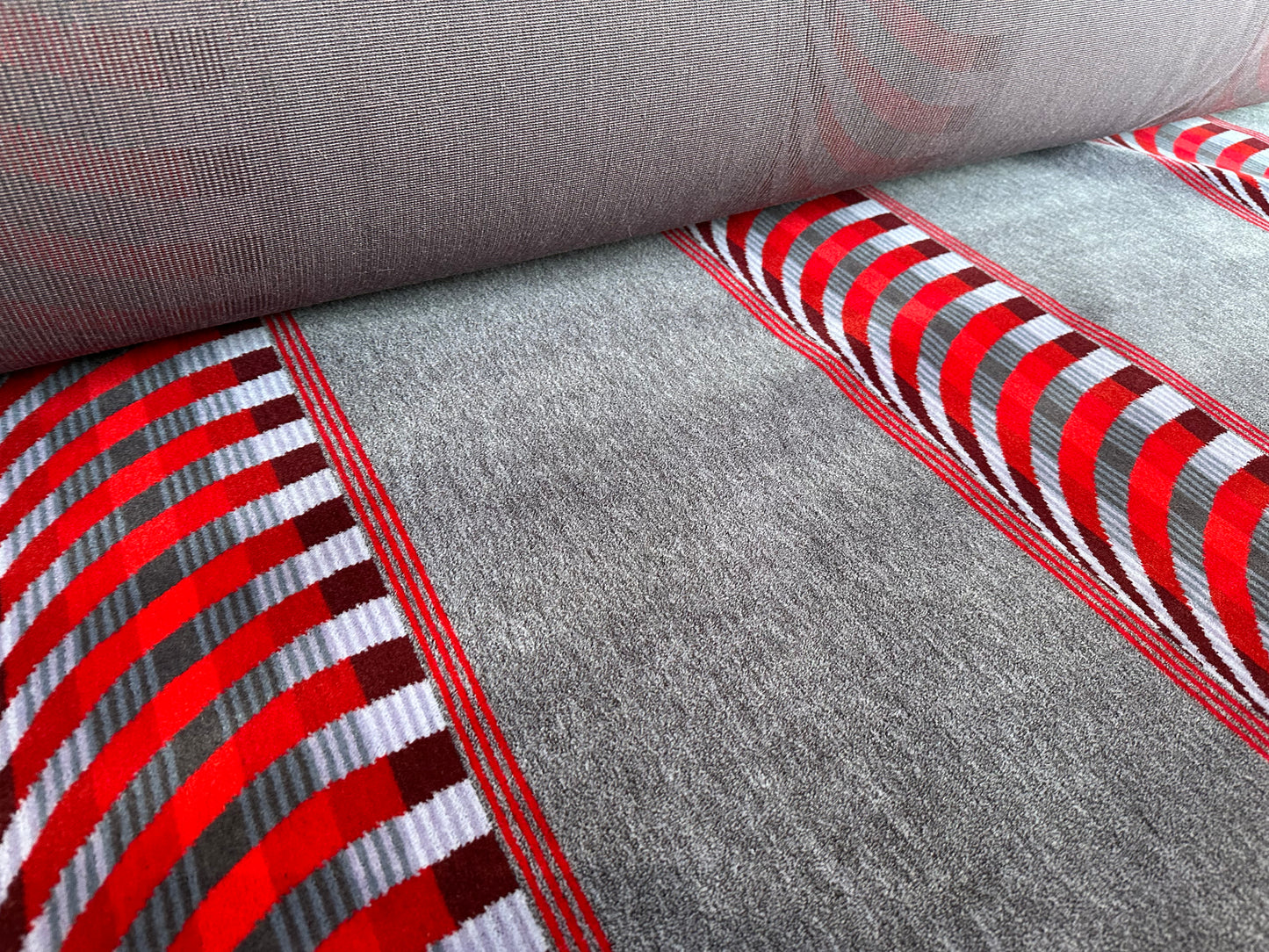 Red cheveron on grey  Moquette Fabric Sold by the Metre