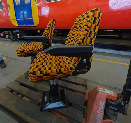 Chapman driver's seat side view showing replacement armrests and original pedestal