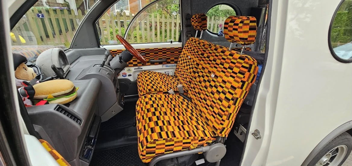 Japanese city car seats upholstered in London Transport moquette
