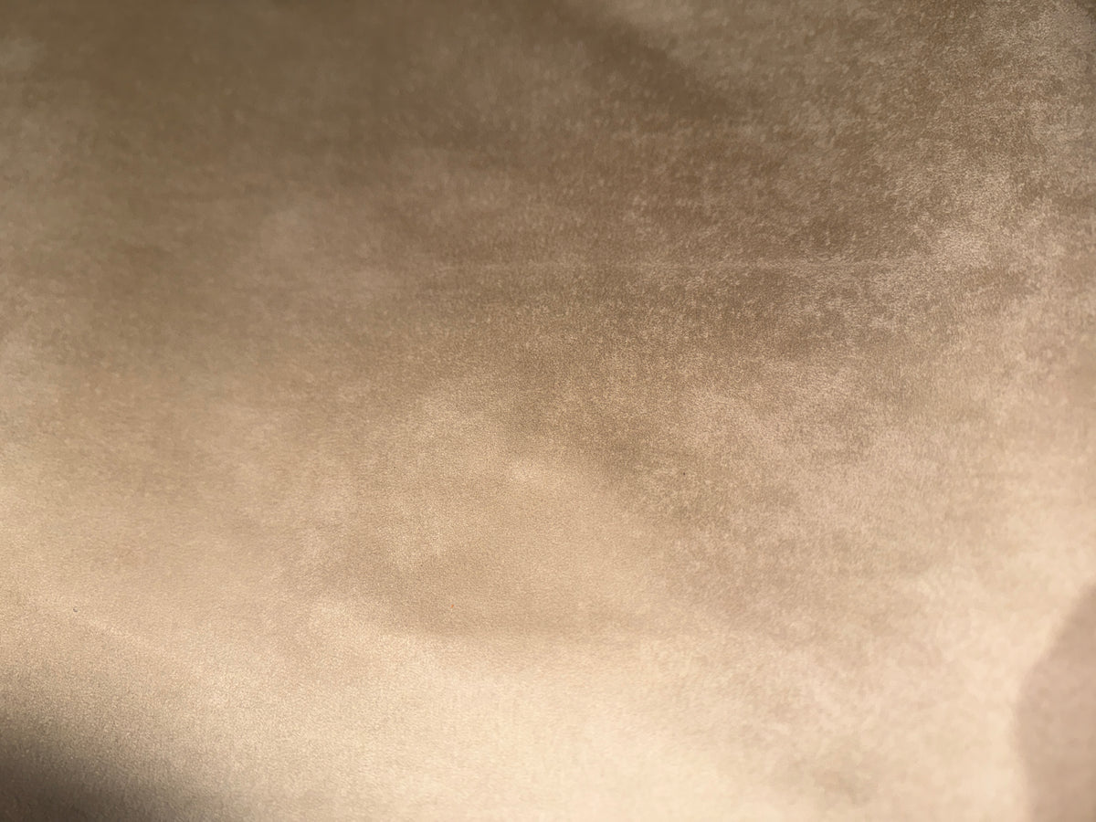 Tan automotive suede-effect upholstery fabric surface