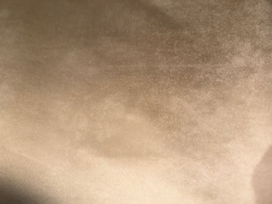 Tan automotive suede-effect upholstery fabric surface