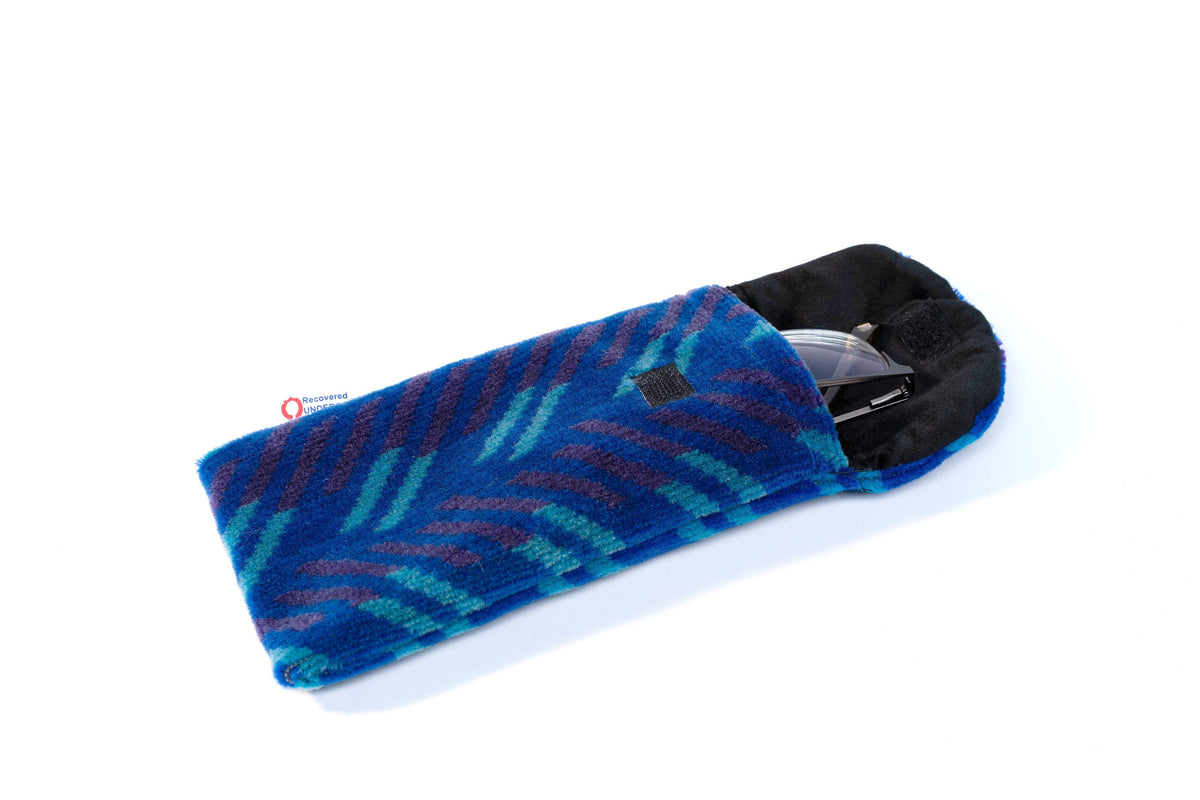 British Rail Network SouthEast Blue Blaze Moquette Phone & Glasses Case in bright blue moquette with turquoise and dark purple diagonal stripes.