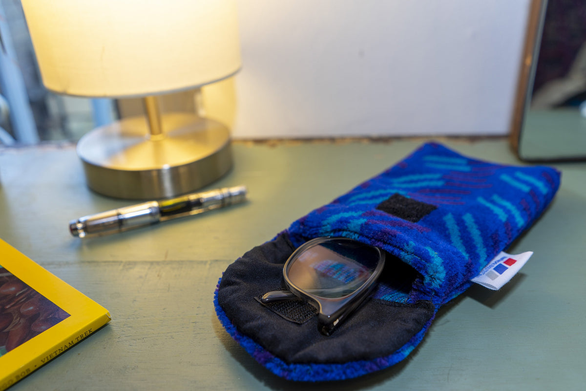 British Rail Network SouthEast Blue Blaze Moquette Phone & Glasses Case in bright blue moquette with turquoise and dark purple diagonal stripes.