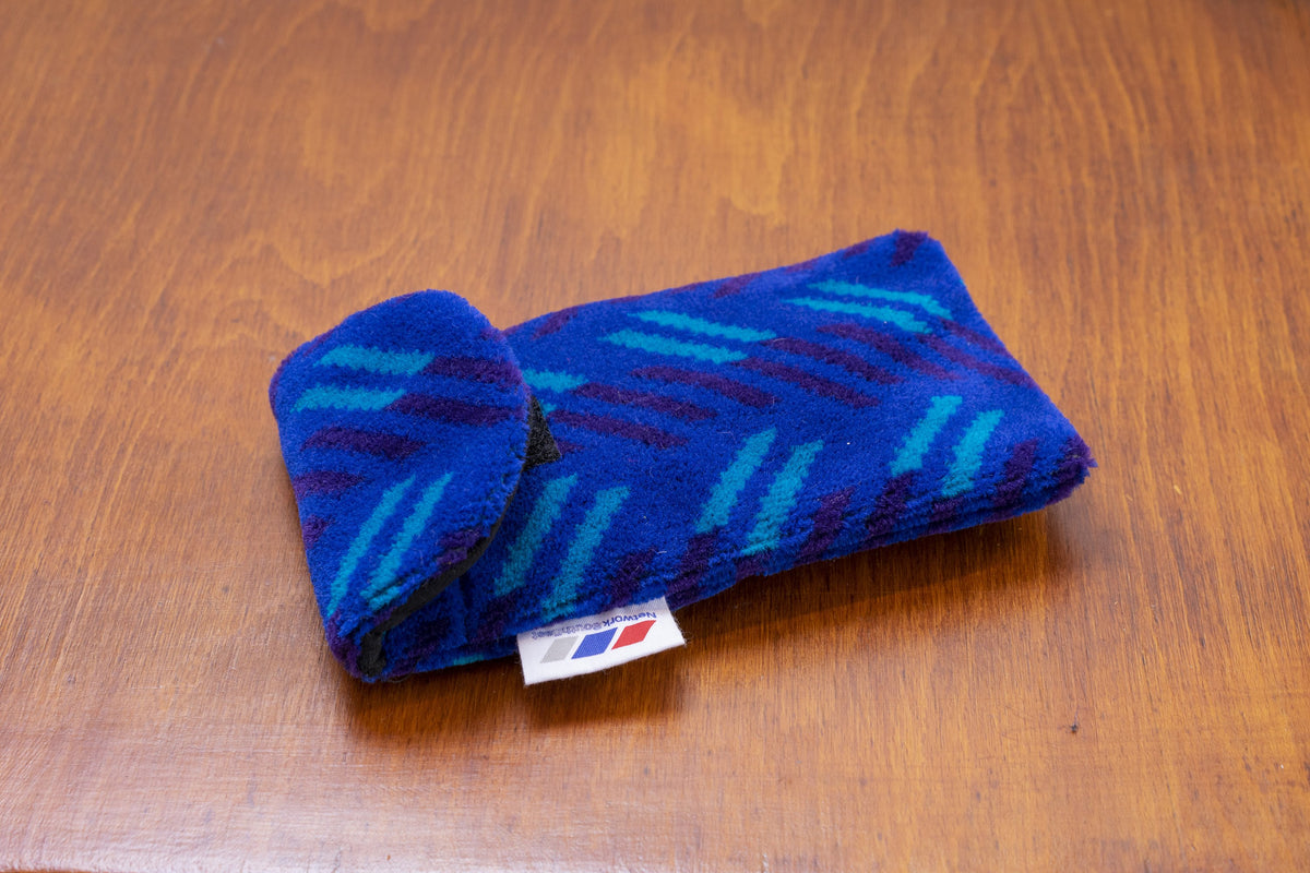 British Rail Network SouthEast Blue Blaze Moquette Phone & Glasses Case in bright blue moquette with turquoise and dark purple diagonal stripes.