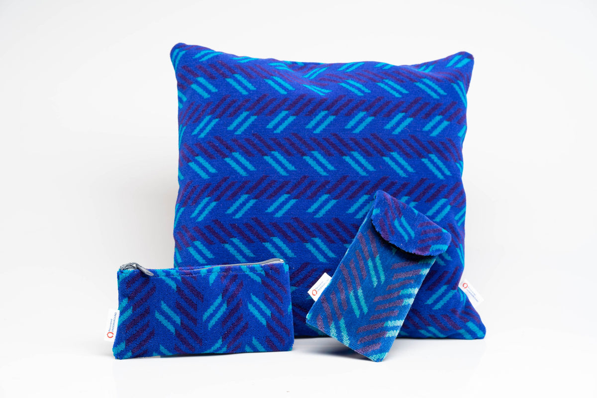 British Rail Network SouthEast Blue Blaze Moquette Phone & Glasses Case in bright blue moquette with turquoise and dark purple diagonal stripes.
