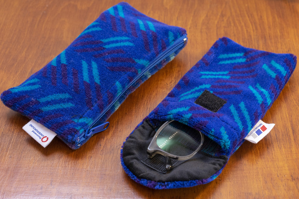 British Rail Network SouthEast Blue Blaze Moquette Phone & Glasses Case in bright blue moquette with turquoise and dark purple diagonal stripes.
