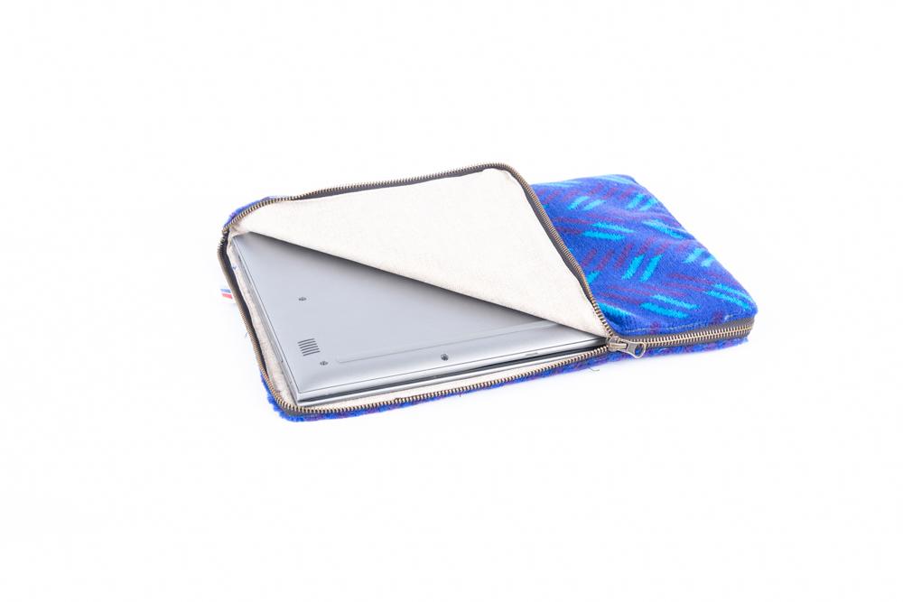 British Rail Network SouthEast Blue Blaze Moquette Laptop Case in bright blue moquette with turquoise and dark purple diagonal stripes.