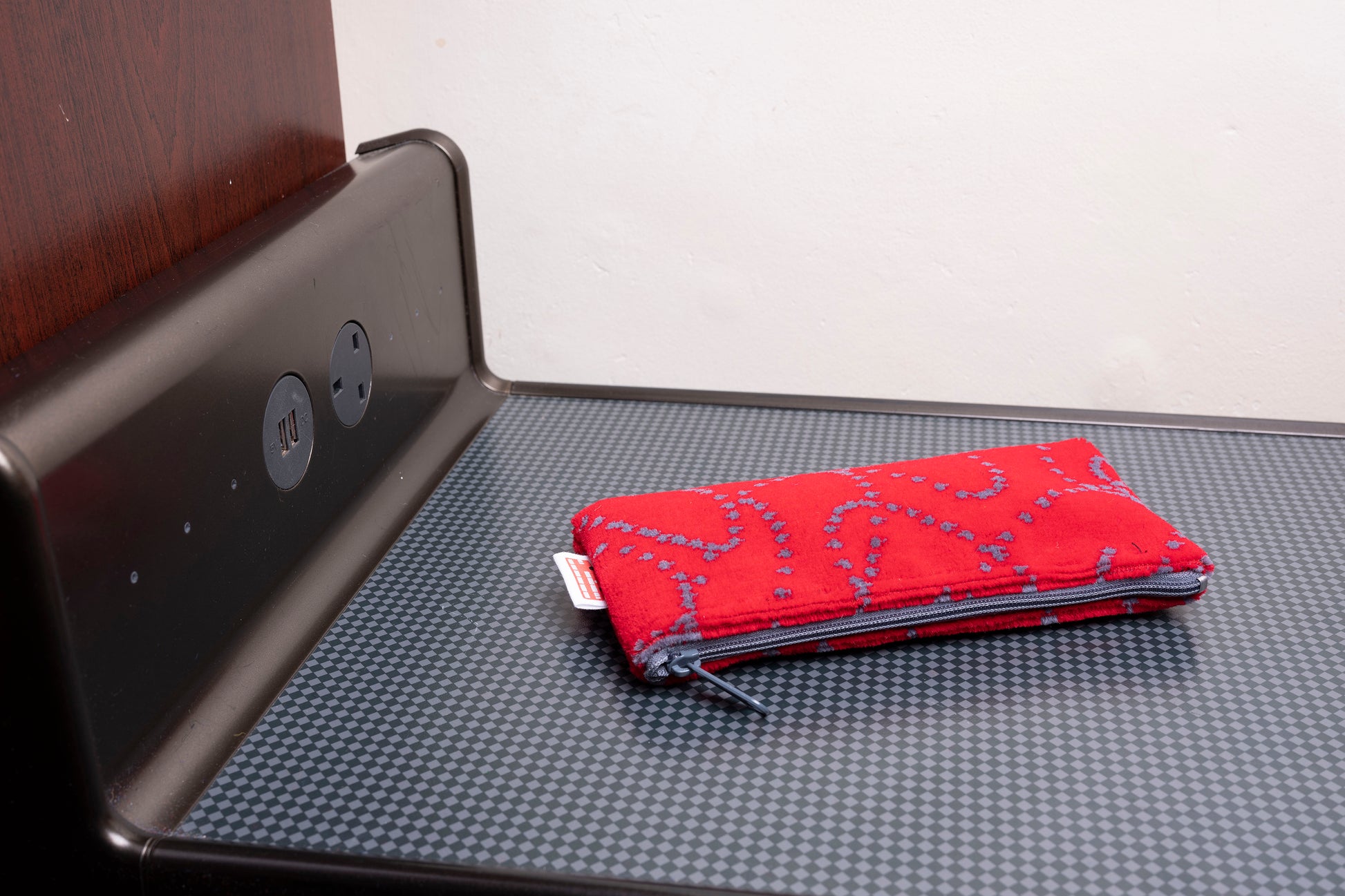 red pencil case with grey dotted lines